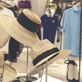 Two hats on rack in retail store